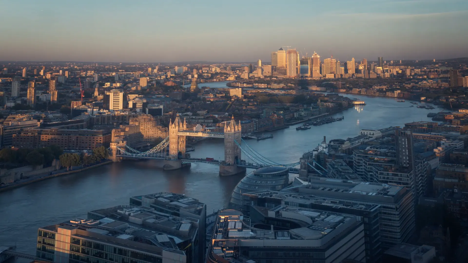 Aerial view over London at dusk, with Tower Bridge and the Thames